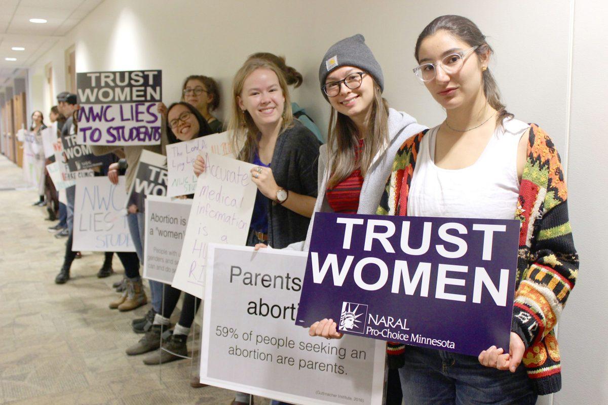 Students stand in silence