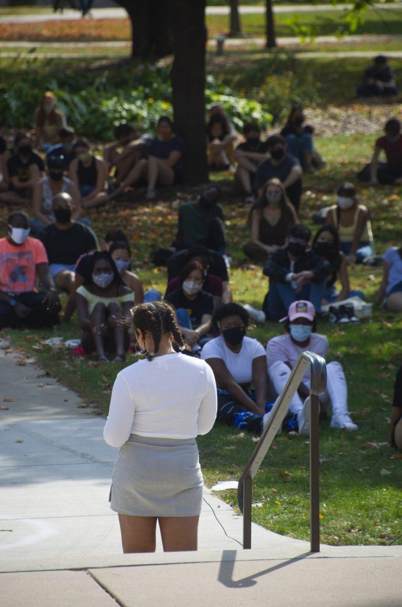 Daaé Ransom recites the poem "Strange Fruit," by Billie Holliday on the steps of Boe Chapel. Madelyn Wood/The Olaf Messenger