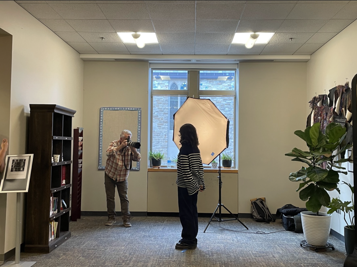 A student poses for their portrait. 