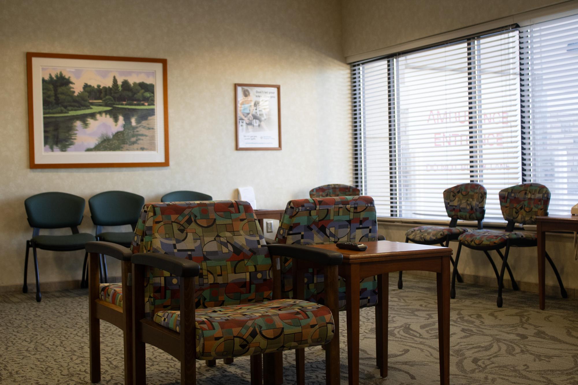 The emergency department waiting room at Northfield Hospital + Clinics sits empty. Uninsured patients qualify only for emergency-only medical assistance, which covers care when conditions become life-threatening.